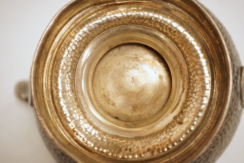 A hammered white metal two handled pedestal bowl, stamped 'Kennedy 925, diameter 18.9cm, 18.1oz.